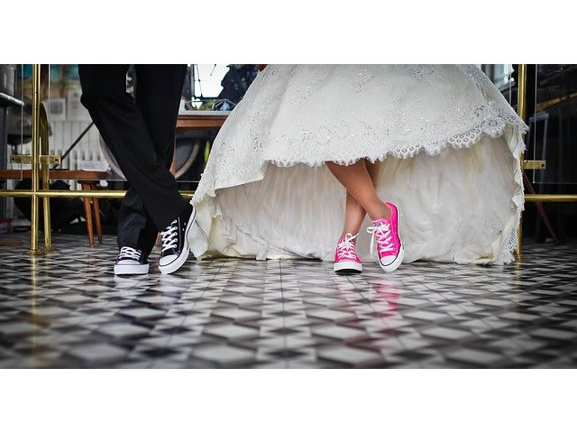 Bride and groom wearing sneakers